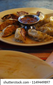 Momo Is A Type Of South Asian Dumpling; Native To Bhutan, Tibet, Nepal, And The Ladakh, Sikkim, Assam And Darjeeling Regions Of India. It Is Similar To Gyoza And Jiaozi.