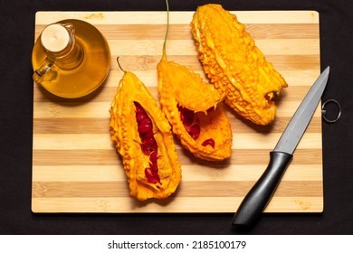Momordica charantias on cutting board with olive oil.Potency Pomegranate.Kudret Narı.Bitter Melon.Top view. - Shutterstock ID 2185100179