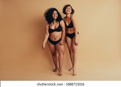 Moms Postpartum Bodies. Two Women With Different Body Types Standing After One Year Of Childbirth.