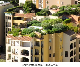 Monaco, Europe - August 2013: Apartment complex with rooftop swimming pool and garden 