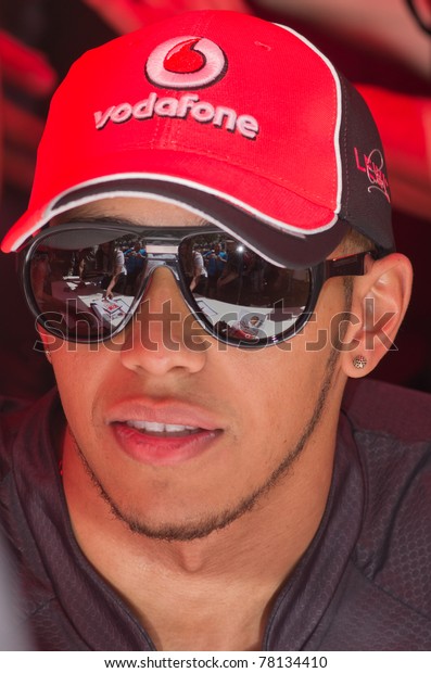 MONACO,\
FRANCE-MAY 28:formula one champion lewis hamilton driver signs\
autograph to fans at the end of the qualify for the grand prix of\
monaco on may 28, 2011 in Monaco,\
france