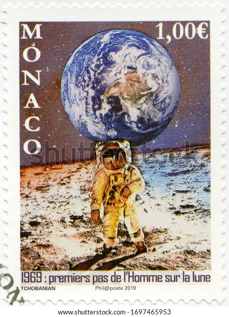 MONACO - JULY 05, 2019: A stamp printed in Monaco\
shows First Moon Landing, 1969, Moon Landing, 50th Anniversary,\
2019