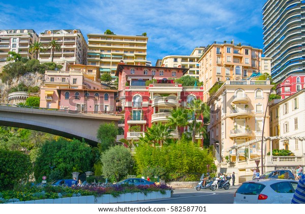 Monaco, Monte Carlo - September 16, 2016:
Residential aria City of Monte Carlo with buildings raised on
mountains and street view with cars and
pedestrians