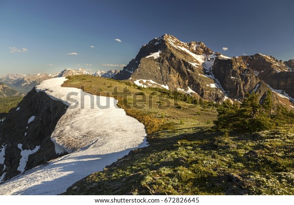 Monarch Ramparts and Distant Mountain Peak\
Landscape on Continental Divide above Healy Pass in Banff National\
Park, Canadian Rocky\
Mountains