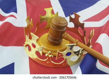 Monarchy And Laws In United Kingdom. Golden Crown With Judge Gavel On UK Flag.	