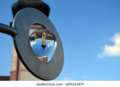 The monastery tower in St.Ulrich in the black forest is reflected in a glass ball - Powered by Shutterstock