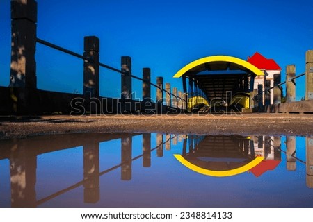 Moncton Bridge over the Petitcodiac River and Water Reflections at the Riverfront Park in New Brunswick, Canada