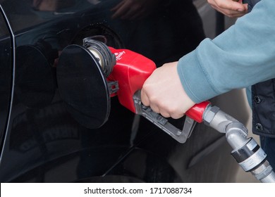 Moncton, New Brunswick, Canada - 27 April 2020 A Man Buying Cheap Fuel At The Costco Gas Station.