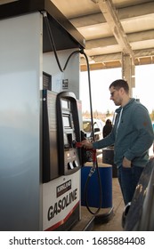 Moncton, New Brunswick, Canada - 28 March 2020 A Man Buying Cheap Fuel At The Costco Gas Station.