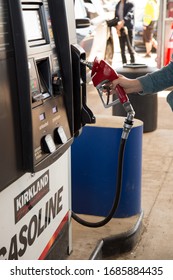 Moncton, New Brunswick, Canada - 28 March 2020 A Man Buying Cheap Fuel At The Costco Gas Station.