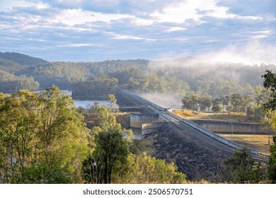 Monduran dam wall, lake landscape, Queensland Australia, drone aerial view, foggy misty morning light - Powered by Shutterstock