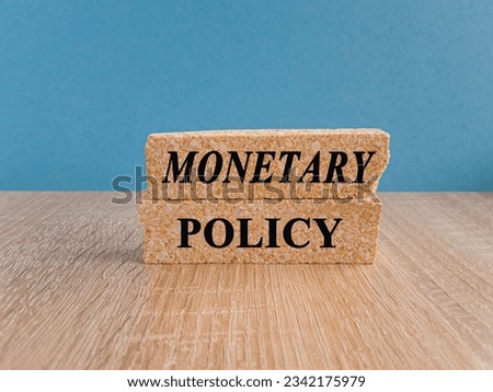 Monetary Policy symbol. Concept words Monetary Policy on brick blocks. Ideas for Increase or Decrease interest rates, Stimulate the economy, Moneyless valuable