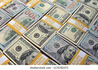 Money background from stacks of $100 dollar bills. Stack of dollars as a background. Cool background made from cash stacks. Piles of US dollars as a background.