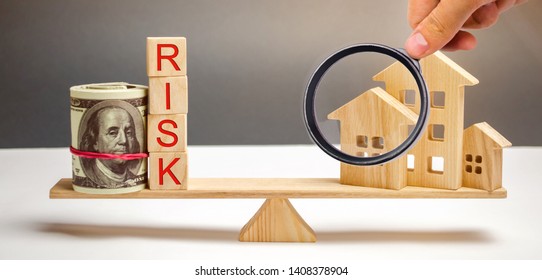 Money Bag, Blocks With The Word Risk And A Wooden House On The Scales. The Concept Of Losing Money When Investing In Real Estate. Risks Of Losing A Home Or Housing For Non-payment. Property Insurance