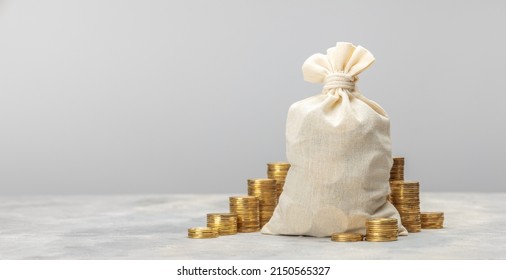 Money bag and coins steps up on a gray background. Template Copy space for text. mock-up; - Shutterstock ID 2150565327