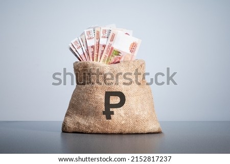 Money bag on which rubles sign. Rubles banknotes. Cash money.