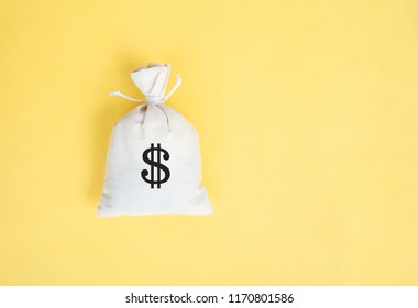 Money Bag On Yellow Background,Minimal Creative Style.