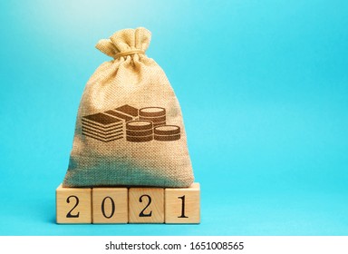 Money Bag And Wooden Blocks 2021. Budget Planning. Business And Economic. Goals And Plans. Investment, Finance. Savings.