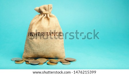 Money bag with the word Inheritance. Separation of inheritance between relatives or transfer of property to charitable organizations. Payment of taxes. Investment funds.