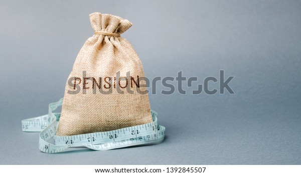 Money bag with the word Pension and tape measure.\
Fall / reduction pension payments. Retirement. Financing retirees.\
Reduction of the pension fund. The low size of pensions. Poverty.\
Lack of money