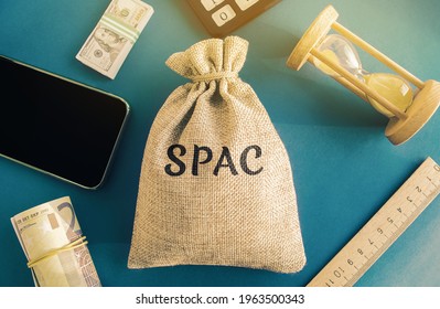 Money Bag With The Word SPAC - Special Purpose Acquisition Company. Simplified Listing Of Company, Merger Bypassing Stock Exchange IPO. Assessment Of Benefits And Risks Of Investments