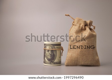 Money banknote and money bag with text LENDING.