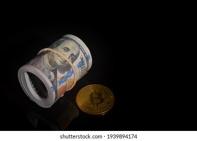 Money banknote and golden bitcoin over black background.