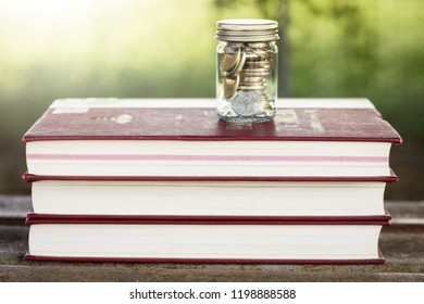 Money in the bottle to use to study in the digital world - Shutterstock ID 1198888588