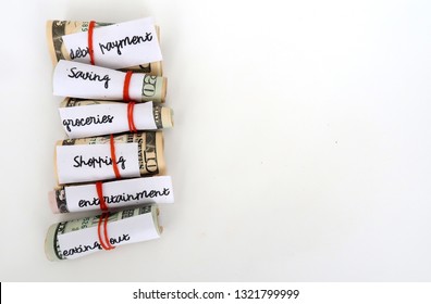 Money Budget Envelope Method - Small Dollars Cash Wrapped With Red Rubber Band For Each Categories Of Expenses - On White Background With Copy Space