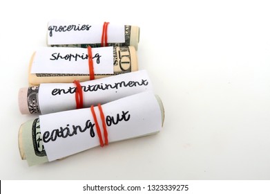 Money Budget Envelope Method - Small Dollars Cash Wrapped With Red Rubber Band For Each Categories Of Expenses - On White Background With Copy Space