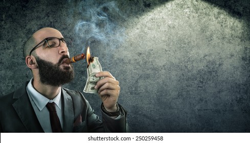 money burning - businessman arrogant 