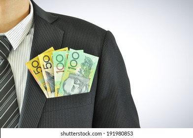 Money in businessman pocket suit - AUD - Australian Dollars