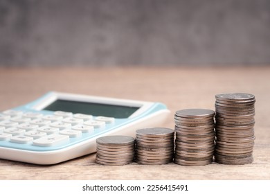 Money with calculator on brown background.Cost calculation concept. - Shutterstock ID 2256415491