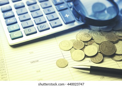 money and calculator on the financial papers