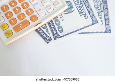 Money And Calculator On White Desk , Financial Concept 