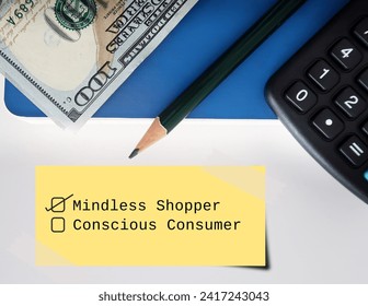 Money calculator pencil on notebook with note written ticking MINDLESS SHOPPER not CONSCIOUS CONSUMER - to overcome impulse buying and become a more conscious consumer