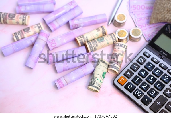 Money with\
calculator with work space and saving money and business growth\
concept,finance and investment\
concept