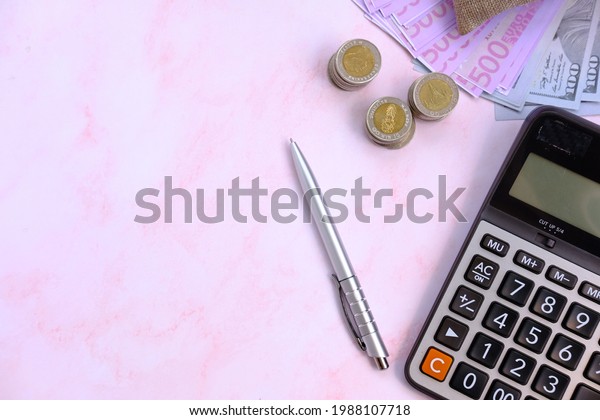 Money with
calculator with work space and saving money and business growth
concept,finance and investment
concept