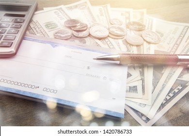 Money And Checkbook With Pen, Calculator On Table