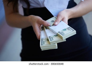 Money close-up in women's hands - Shutterstock ID 300650048