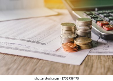 Money Coin On Accounting Report Sheet Background, Saving Money Or Financial Concept. 