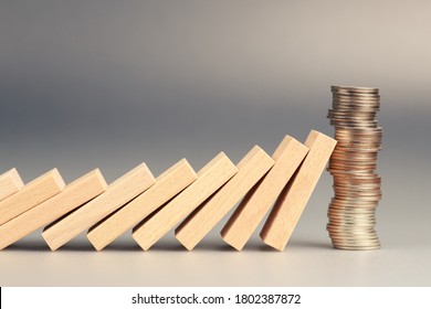 Money Coins Heap Still Balance And Stop The Falling Domino, Financial Stability Concept