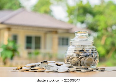 money coins with home, Saving for buy home concept