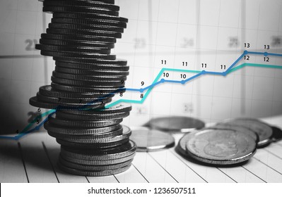 Money coins stack with stock market graphic design with calendar background for financial concept.