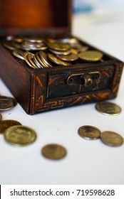 money coins the treasure chest on white background