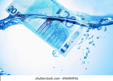 Money Concept Showing Euro Banknote Sinking In Water As A Symbol Of Global Economic Crisis