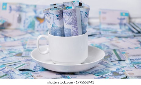 Money In A Cup Of Coffee. Tenge, The National Currency Of Kazakhstan. Concept, Living Wage. Economy, Central Asia