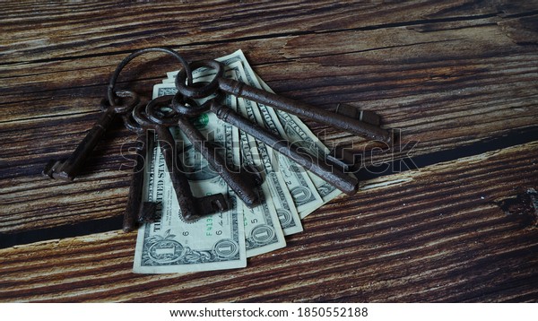 Money\
currency dollars and keys of investing for\
profit