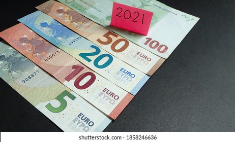 Money/ Currency; Euro On Black Background./ Stack Of Euro Banknote. / Budgeting And Forecasting For Year 2021