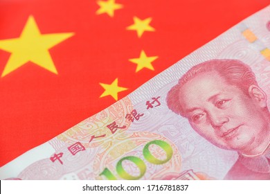 Money  Currency Of PBOC Or People's Bank Of China. One Hundred CNY Chinese Yuan Bill With A Flag Of China. 100 Rmb Or Renminbi, Depicts Beijing Economy System, Public Banking Policy And Interest Rate